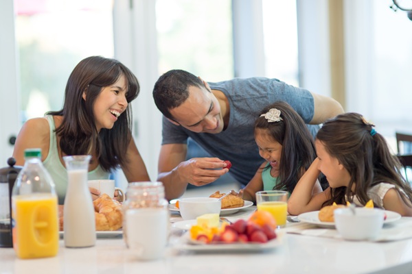 Hawaii employee with family eating breakfast